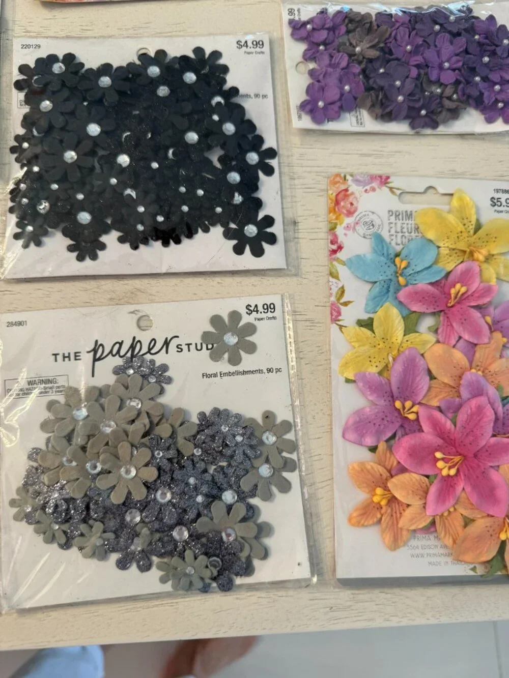 10 packages of fabric floral embellishments, NWT in beautiful colors